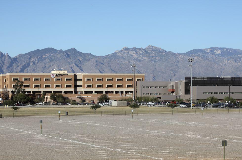 TUCSON, AZ - NOVEMBER 25, 2014: The University of Arizona Medical Center against Santa Catalina mountain range and blue sky as seen from south side.