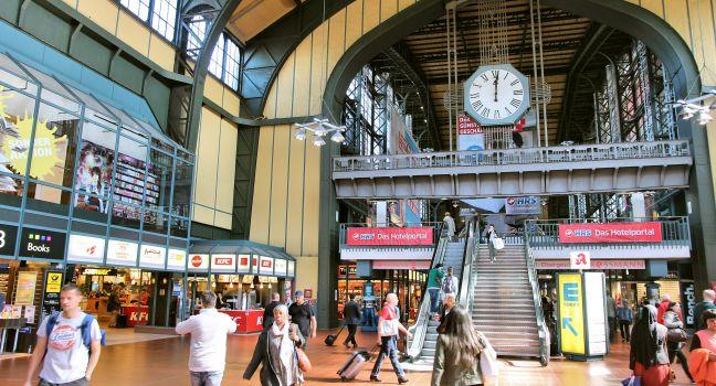 HAMBURG, GERMANY - AUGUST 28, 2014: Travelers walk inside the Central Railway Station (Hauptbahnhof) in Hamburg. With 450,000 daily passengers it is the 2nd busies station in Europe.