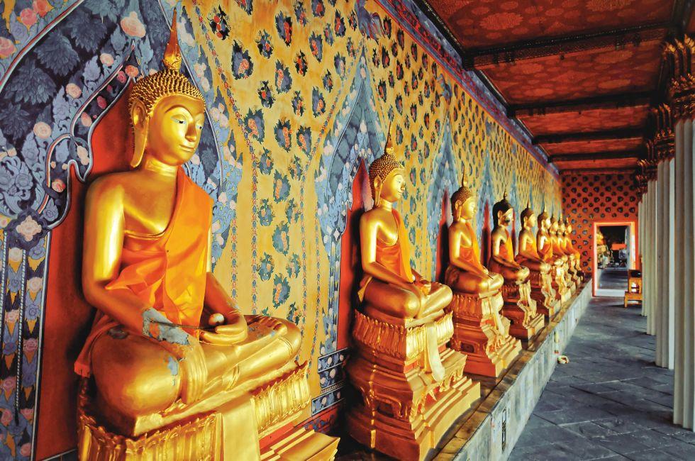 BANGKOK, THAILAND - AUGUST 11: golden Buddha statues in Wat Arun temple, Bangkok - Thailand on August 11,2012. Buddhism is Thailand official religion and is the religion of more than 90% of its people; Shutterstock ID 131225321; Project/Title: Bangkok App;