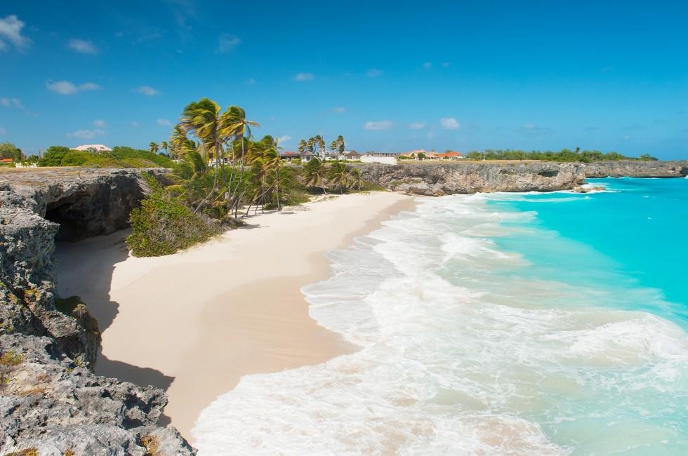 Bottom Bay is one of the most beautiful beaches on the Caribbean island of Barbados. It is a tropical paradise with palms hanging over turquoise sea and a pirate cave