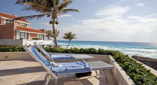 CANCUN, MEXICO - MARCH 18: Two Sunbathing Chairs toward the Ocean in a beach resort on March 18, 2011 in Cancun. There are about 140 hotels in Cancun with more than 24,000 rooms and 380 restaurants.