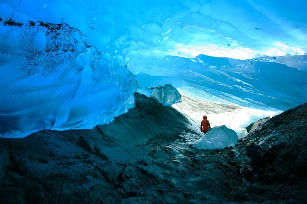 Explorer Inside Ice Cave, Mendenhall Glacier, Juneau, Alaska, USA;  