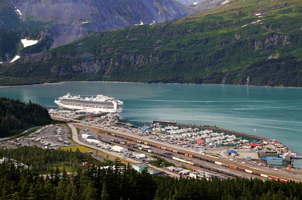 Overlooking Whittier Alaska on a summer day with a large cruise ship in port.