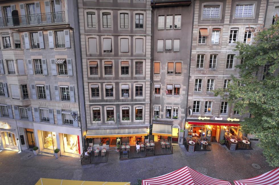 High-angle view of some old and charming houses on Rue de la Fontaine in the old town of Geneva, Switzerland. 