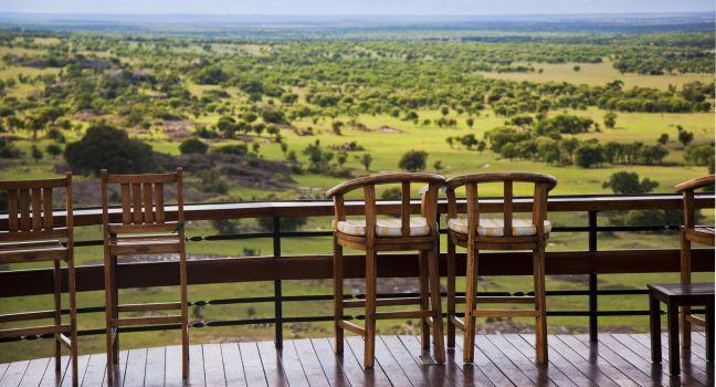 Savannah landscape in  Serengeti Tanzania, Africa. Chairs on the terrace for observation