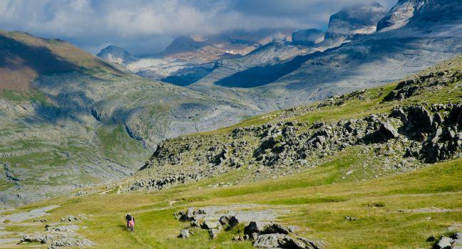PYRENEES, SPAIN - CIRCA JULY, 2012 - Two peple hiking in the Spanish Pyrenees (GR11 trail) near Ordesa y Monte Perdido National Park, Spain