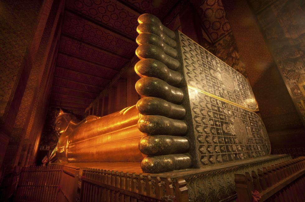 The Big golden Reclining Buddha within Wat Pho is the important temple in Bangkok, Thailand.; Shutterstock ID 91978364; Project/Title: Photo Database Top 200