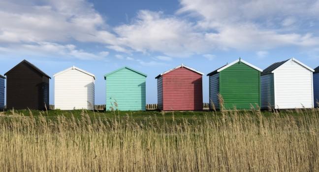 Colorful Beach huts at Calshot on the Solent near Southampton in Hampshire.