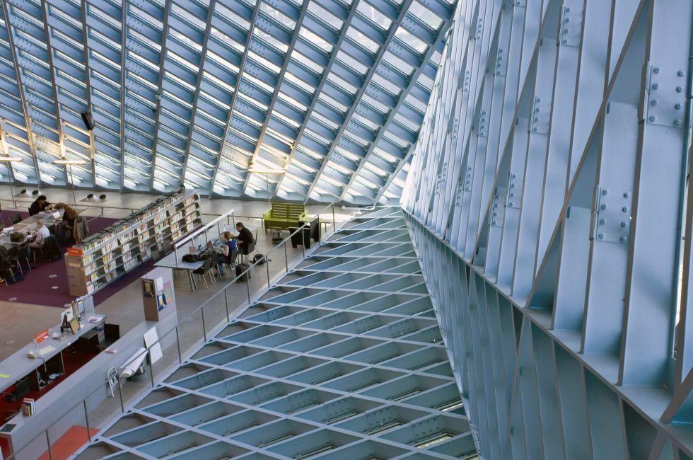 It is the main lobby of Seattle Central library. The unique glass walls and roofs are for good natural daylight. It is a very environmental building.