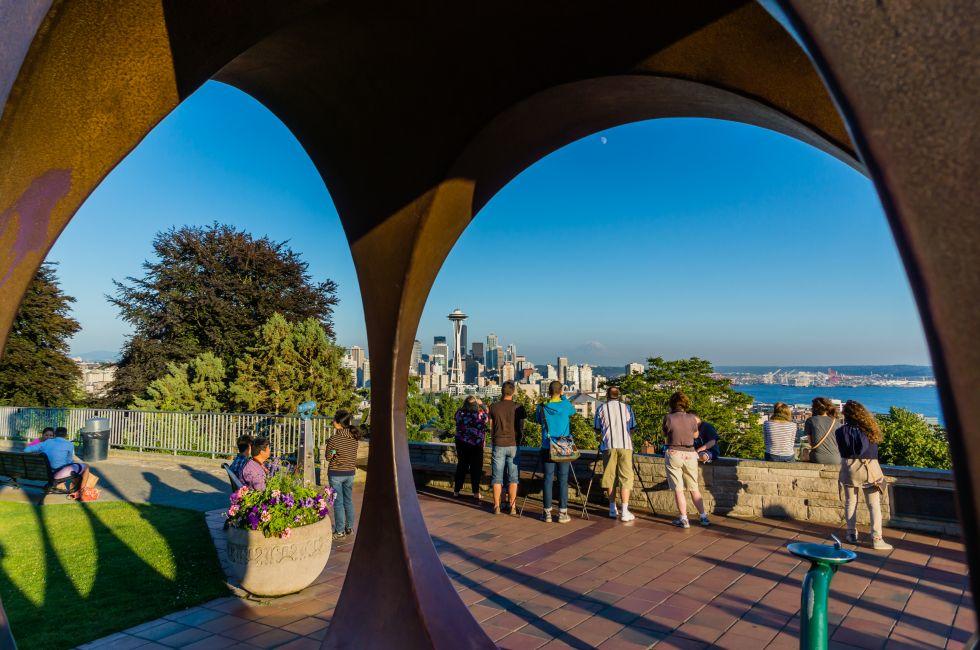 Seattle tourists at famous Kerry Park taking pictures at dusk.