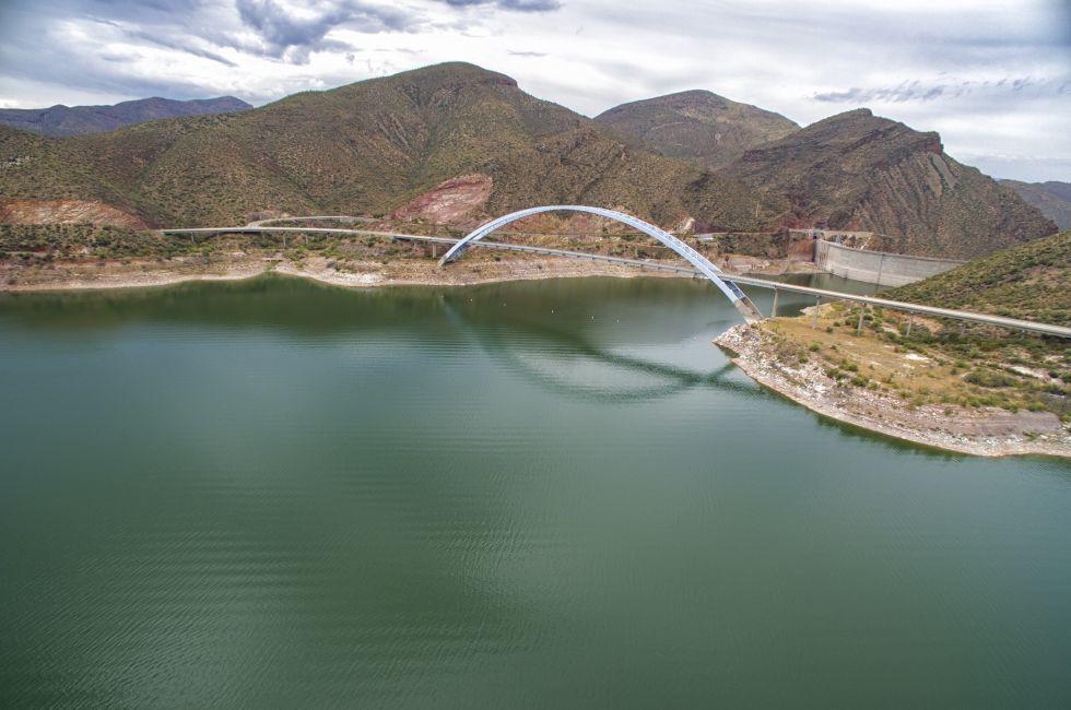Panorama of Roosevelt Lake, bridge and Theodore Roosevelt Dam which are located at Apache trail scenic drive in Arizona, close to Phoenix. Picture was taken on 4th August, 2015.