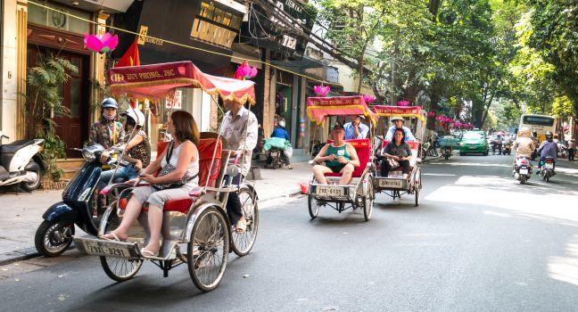 HA NOI, VIET NAM, August 6, 2014 the old town area, the center of Ha Noi, Viet Nam, many tourists choose to go with water shining pedicabs, watching the old town