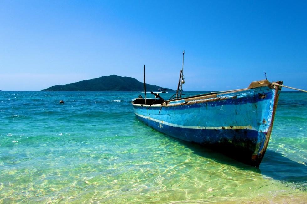 Lone Boat on tropical paradise island Honduras caribbean; Shutterstock ID 70700359; Project/Title: SV_2014