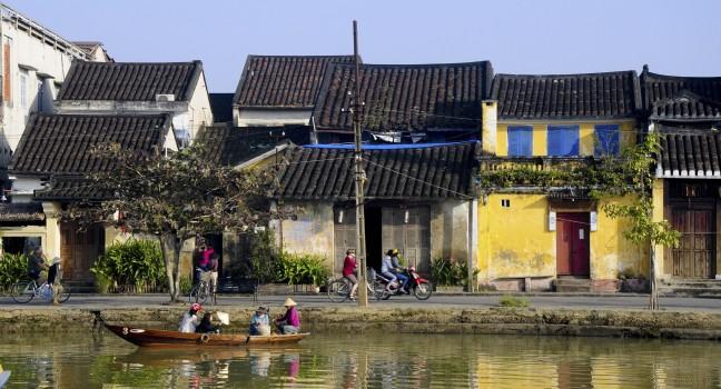 HOIAN, VIETNAM, JANUARY 21: A boat in Hoai river on January 21, 2013 in Hoian, Vietnam. Hoian is recognized as a World Heritage Site by UNESCO.; 