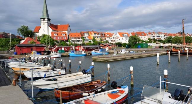 Marina and white church in Ronne, Bornholm, Denmark; 
