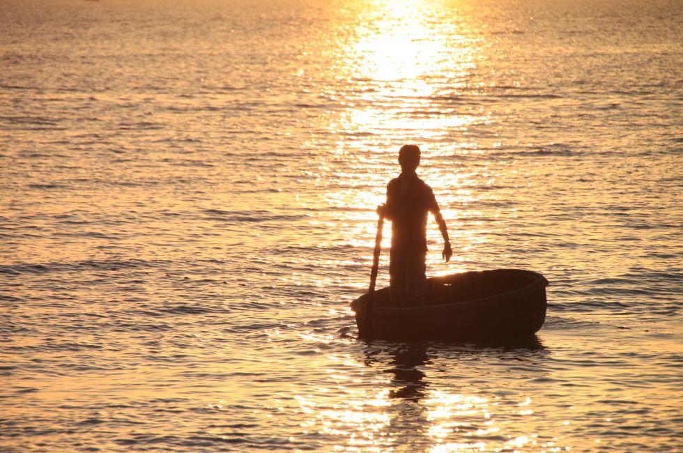 Fisherman in the sunset at Long Beach on Phu Quoc Island, Vietnam.