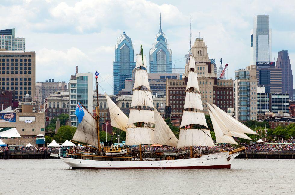 Picton Castle, a 179&#x2019; long, 284-ton, three-masted barque sails in front of the Independence Seaport Museum (formerly the Philadelphia Maritime Museum) in the Penn's Landing complex along the Delaware River during Parade of Sails as part of Tall Ship