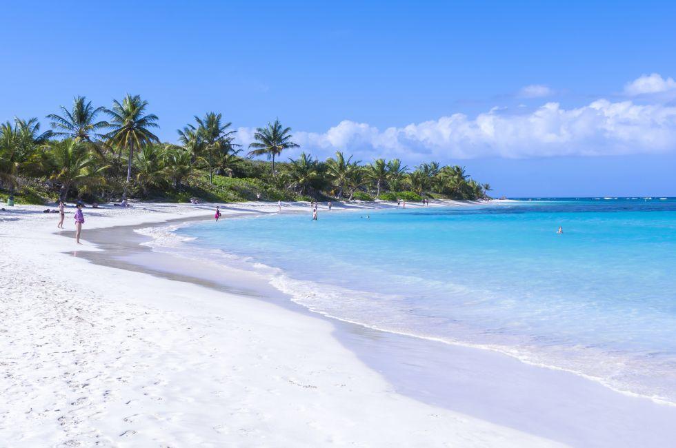 CULEBRA, PUERTO RICO - JANUARY 21, 2014: Vacationers enjoy the clear blue water and warm sunshine on one of the world's best beaches, Flamenco Beach, on the Puerto Rican island of Culebra