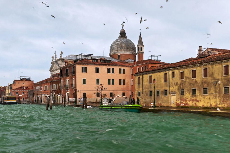 Guidecca houses and Santissimo Redentore Church next to the water.